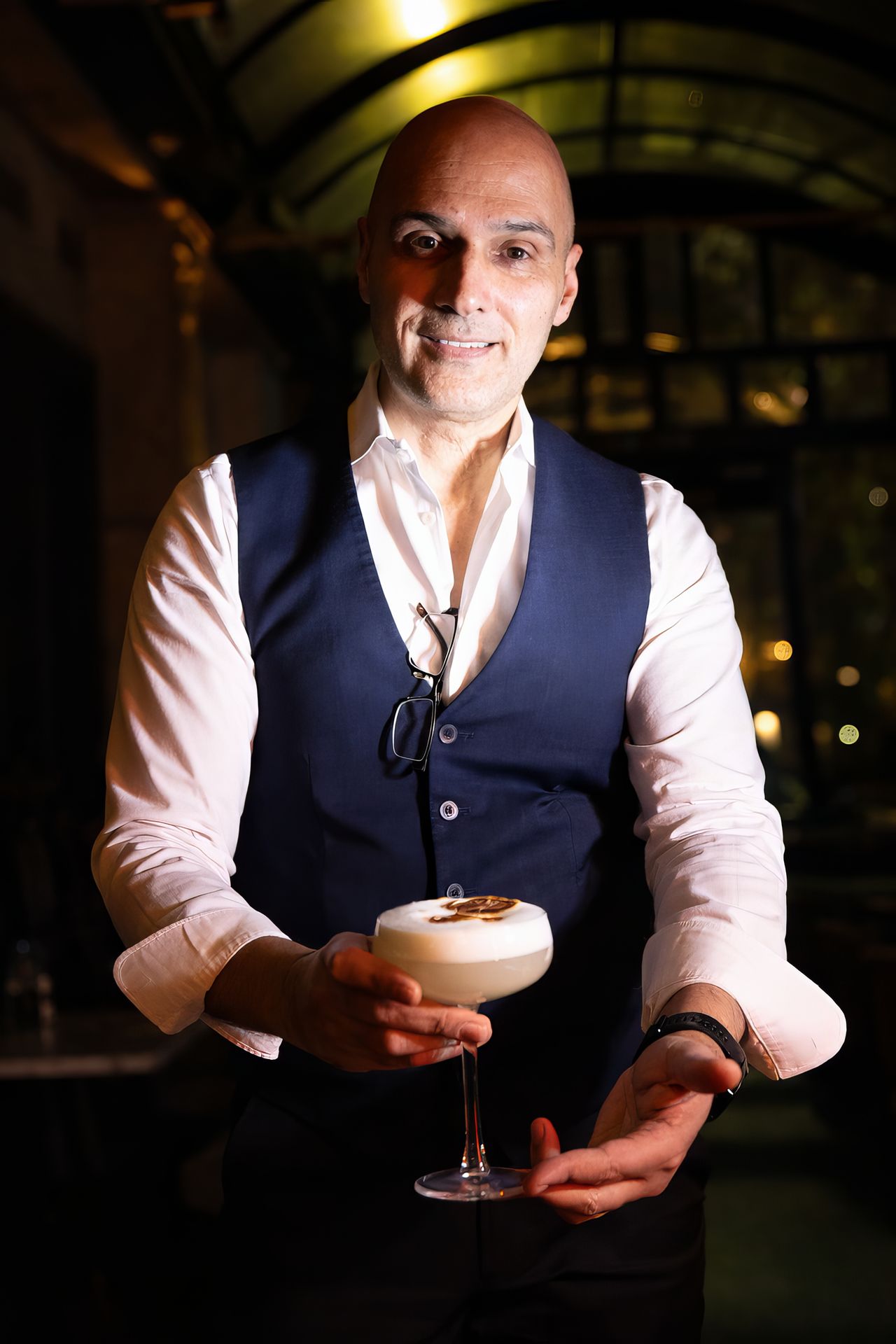 bartender holding cocktail